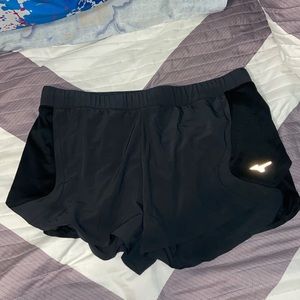dark grey and black mizuno athletic shorts